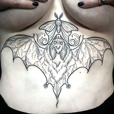 Bat Under Breast Tattoo