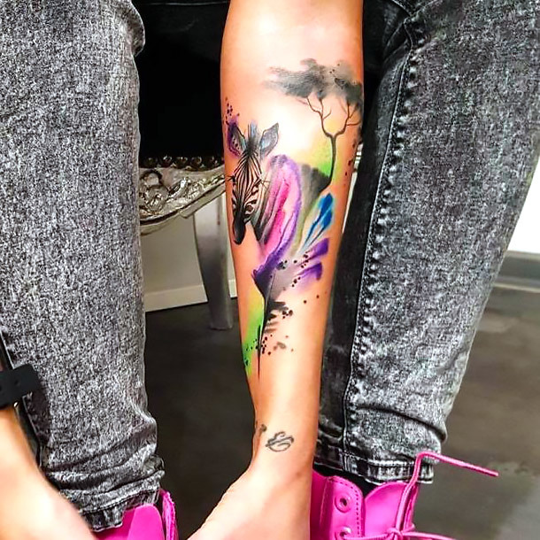 Colorful Zebra on Forearm Tattoo Idea