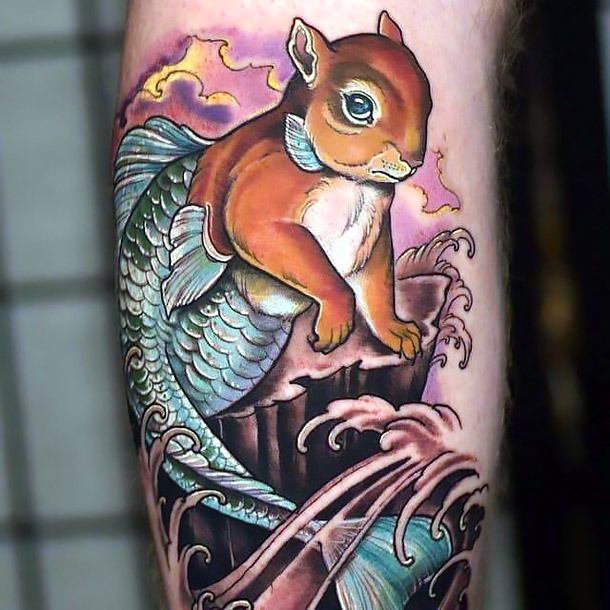 A weird tattoo idea of a half-rabbit half-fish inked on the shoulder. 