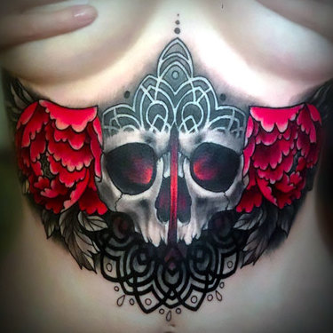 Skull Under Breast Tattoo