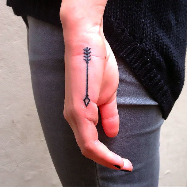 Small Arrow on Hand Tattoo Idea