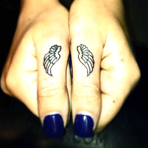 Small Matching Wings on Fingers Tattoo Idea