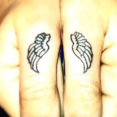 Small Matching Wings on Fingers Tattoo