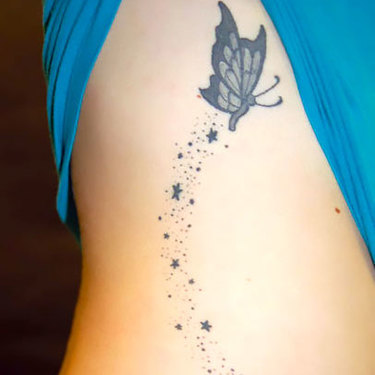 Small Butterfly on Ribs Tattoo