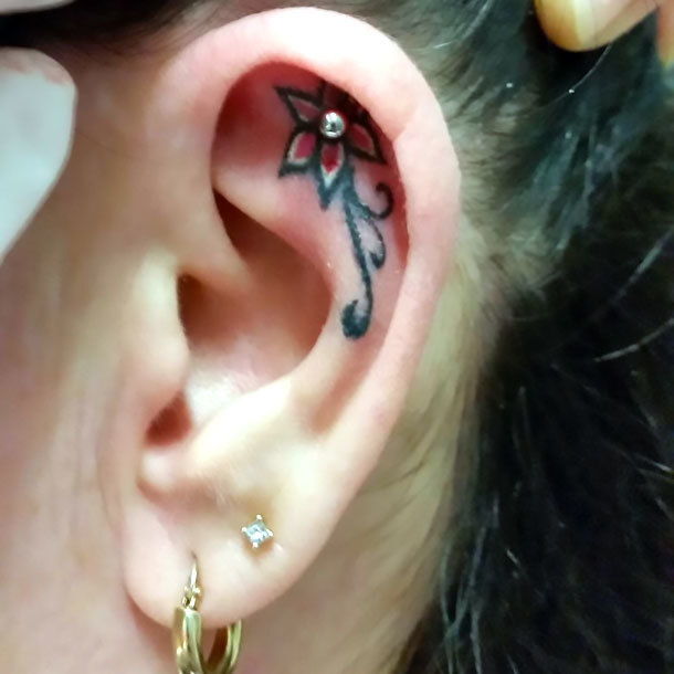 Small Flower on Ear Tattoo Idea