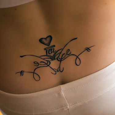 Small Heart on Lower Back Tattoo