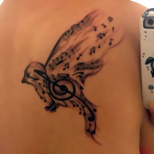 Songbird Tattoo on Back Tattoo Idea