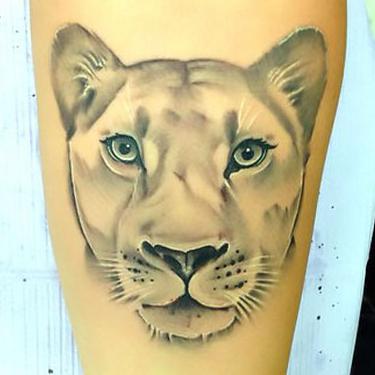 Amazing Lioness Face Tattoo