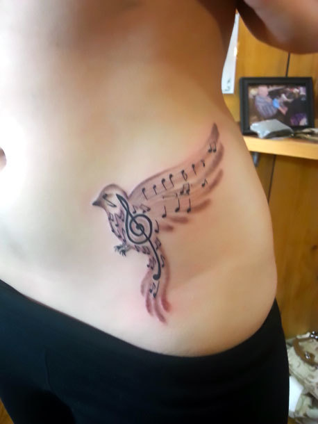 Small Songbird on Hip Tattoo Idea