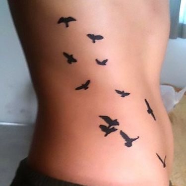 Flock of Birds on Side Tattoo