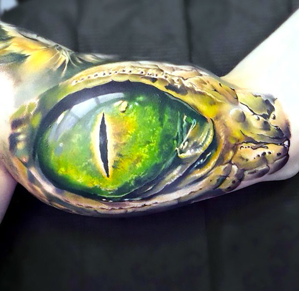 3D Lizard Eye on Bicep Tattoo Idea