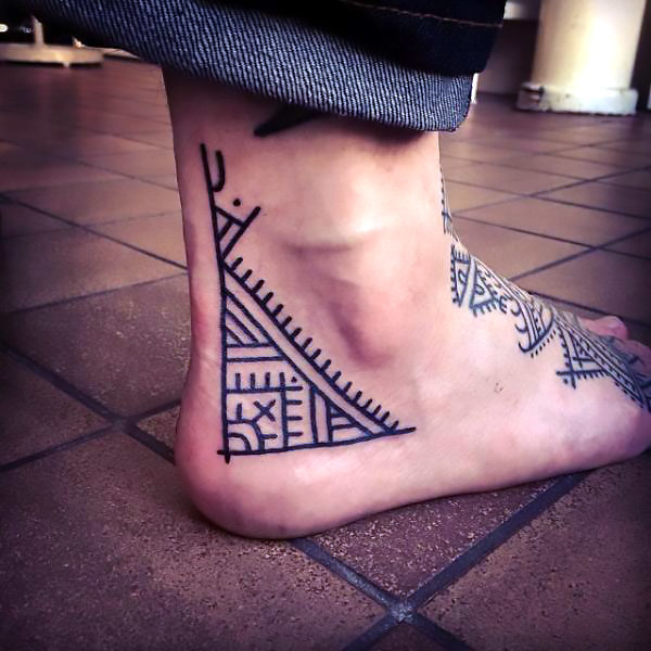 Tribal Ornates Side of Heel Tattoo Idea