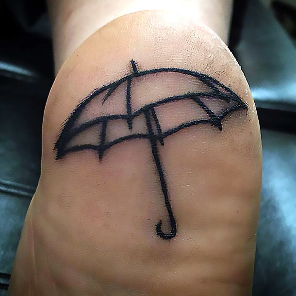 Umbrella Heel Tattoo Idea