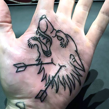 Wolf on Palm Tattoo