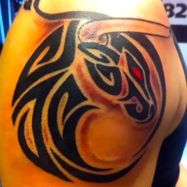 Tribal Bull With Red Eye Tattoo