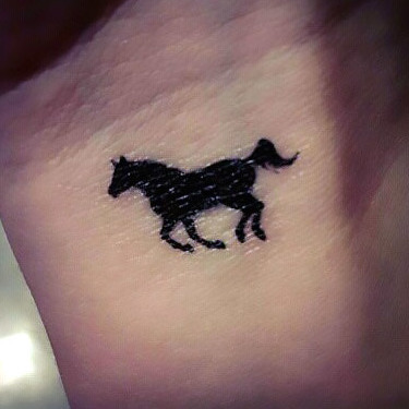 Small Horse Silhouette Tattoo
