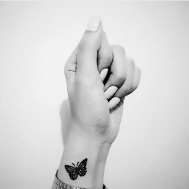 Small Butterfly on Wrist Tattoo