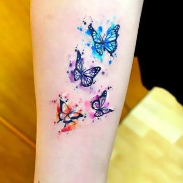 Watercolor Small Butterflies Tattoo