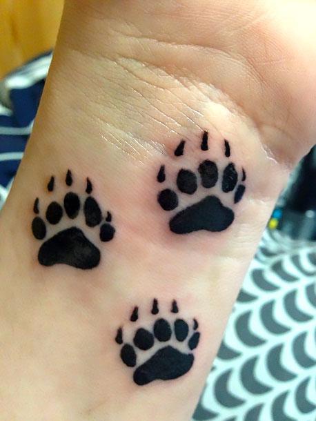 Bear Paw Prints Tattoo Idea