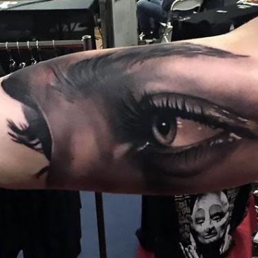 Black and Gray Eyes on Bicep Tattoo